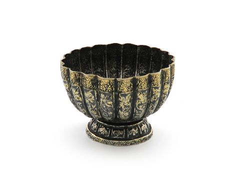 A 19th century Thai silver-gilt and enamel bowl, unmarked, fluted circular form, with foliate niello work decoration, on a ci