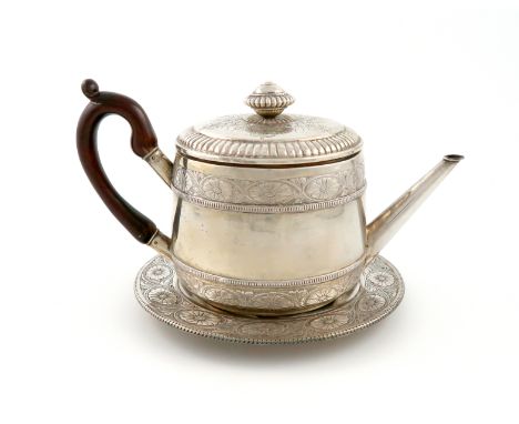 A 20th century Italian silver teapot and stand, circular form, embossed with foliate decoration and an armorial, the pull-off