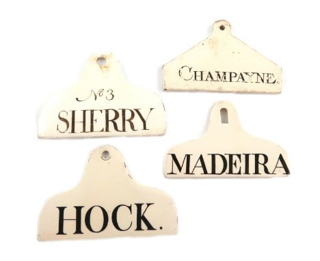 A collection of four early 19th century creamware bin labels, coat hanger form, titled 'N0.3 SHERRY', 'HOCK', 'MADEIRA' and '