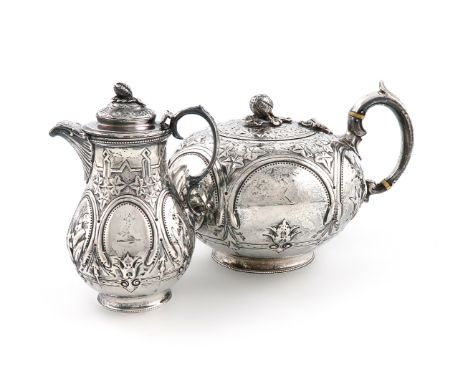 λA Victorian silver teapot and matching hot water pot, by Samuel Hayne. London 1864, circular form, embossed foliate and flor