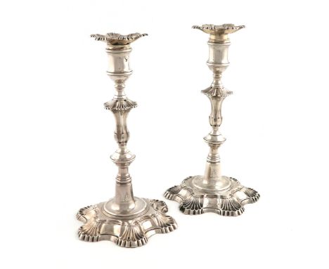 A pair of George II silver candlesticks, by John Cafe, London 1753, knopped baluster stems, shell shoulders, spool-shaped cap