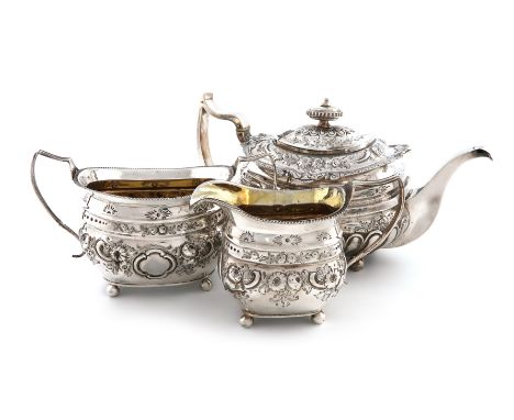 λA matched three-piece George III silver tea set, the teapot by Solomon Hougham, London 1812, the others by Alexander Field, 