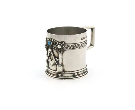 By Amy Stewart, an Arts and Crafts silver Masonic mug, Chester 1921, cylindrical form, spot-hammered decoration, applied with