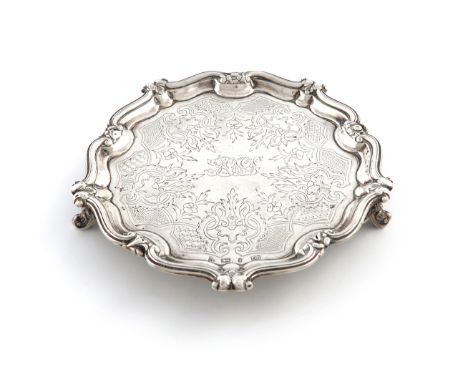 An early Victorian silver waiter, by Henry Wilkinson and Co., Sheffield 1839, circular form, foliate scroll border, the centr