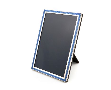 A silver and blue enamel photograph frame, by Sanders &amp; Mackenzie, Birmingham 1915, upright rectangular form, the enamel 