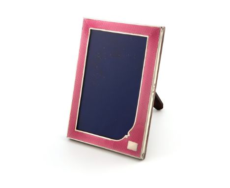 A silver and pink enamel photograph frame, by S M Levi Ltd, Birmingham 1932, upright rectangular form, the enamel on an engin