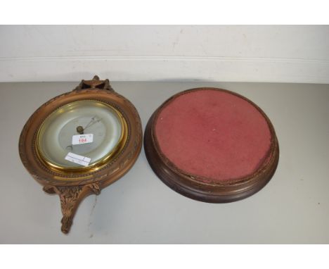 ANEROID BAROMETER IN GILT FINISHED FRAME WITH PRESENTATION PLAQUE DATED 1954, TOGETHER WITH A FURTHER TURNED WOODEN STAND
