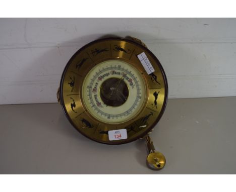 ANEROID BAROMETER IN A CASE DECORATED WITH SIGNS OF THE ZODIAC