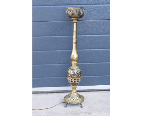 An early 20th century North African brass lamp base with inlaid decoration. 76cm tall. Untested. 