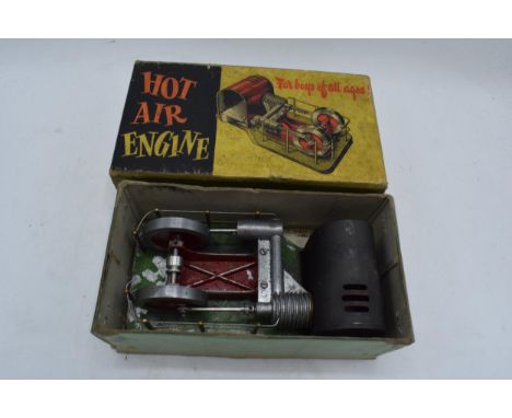 A boxed early 20th Century live hot air engine manufactured by Davies Charlton Ltd from the Isle of Man. Untested. 