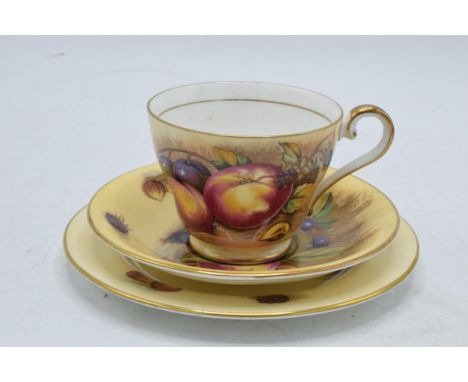 Aynsley Orchard Gold trio consisting of a cup, saucer and side plate (3). Cup signed by N Brunt, the other 2 pieces signed by