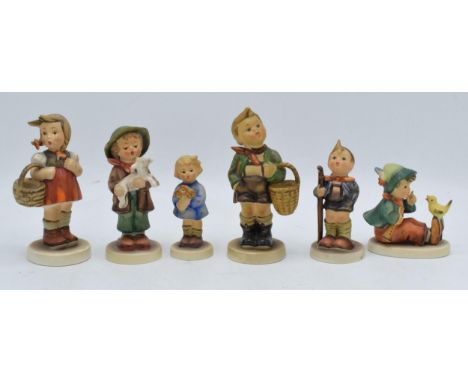 A collection of Goebel / Hummel figures to include Girl with Flowers, boy with chick, girl with basket and 3 others (6). In g