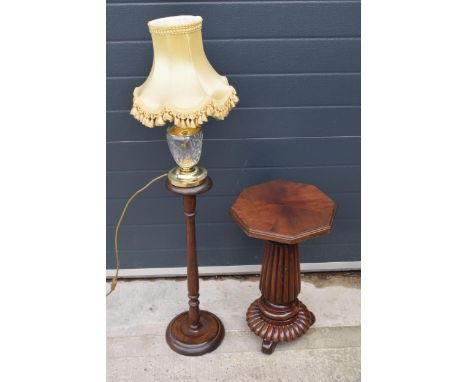 A quarter-veneered pedestal table together with a glass and brass lamp sitting on turned wooden column (3). 114cm tallest. 