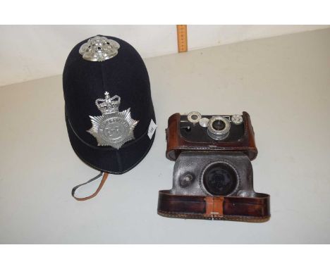 A Metropolitan Police hat together with a vintage Argus camera