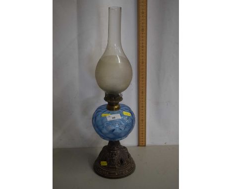 Cast based oil lamp with blue glass font