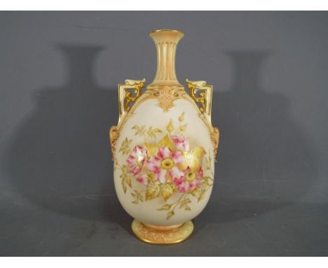 Royal Worcester - A Royal Worcester twin handled blush ivory vase, with floral decoration and gilt highlights, shape 1539 cir