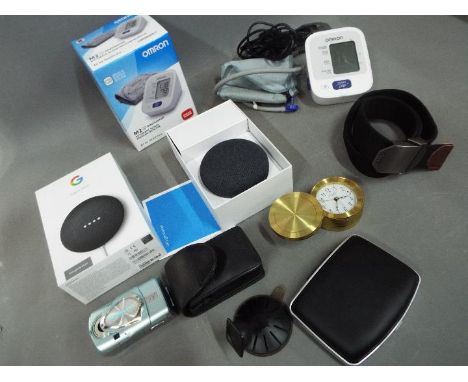 A mixed lot to include a boxed Google Nest Mini (appears unused), boxed Omron automatic blood pressue monitor, Olympus camera