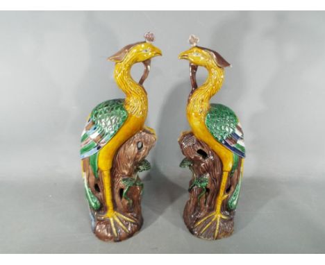 A pair of 19th Chinese sancai glaze figurines depicting Fenghuang (phoenix), approximately 32 cm (h). [2] Condition Report - 