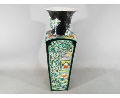 A rare Chinese famille noir Kangxi vase with everted rim, decorated with applied moulded Immortals on clouds, with a square s