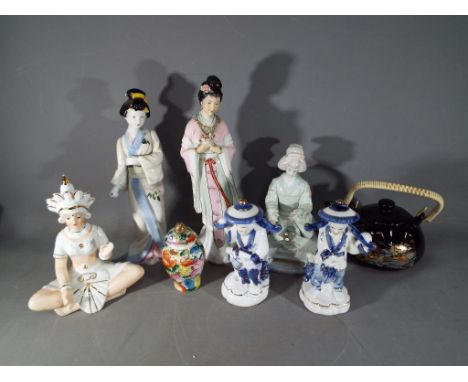 A quantity of ceramics to include figurines, small covered jar and teapot.