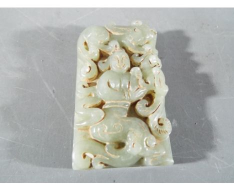 A small Chinese rectangular jade plaque depicting a central figure surrounded by mythical creatures, approximately 7 cm x 4 c