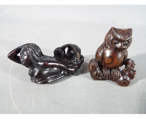 A vintage Japanese dark wood Netsuke depicting an Owl seated on a thick branch or log,  signed and a vintage Japanese dark wo