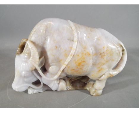A large, good quality, Chinese mottled grey jade carving of a buffalo, approximately 15.5 cm (h)