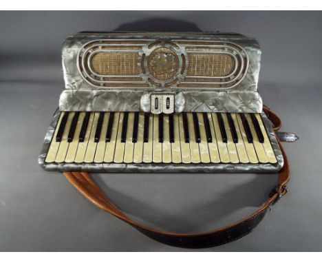 A vintage piano accordion by Fontanella, contained in a case