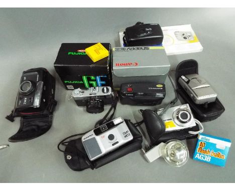 Photographic Equipment - A quantity of cameras and similar to include Canon, Olympus, Kodak, Fujica and similar.