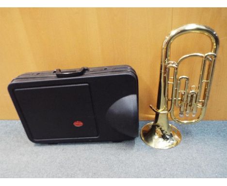 A Stagg 77-BAP baritone horn contained in hard case. Condition Report - the bell is heavily dented and scratched, various oth