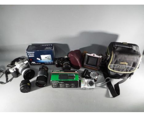 Photography - A quantity of photographic equipment to include a Cosina CT4 camera, Agfa Isolette, Minolta 505si Super, Kestre