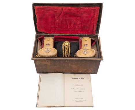 A WWII period Royal Navy Regulation bicorn hat and epaulettes in  Russian lacquer trunk:,  the bicorn hat with gilt brocade, 