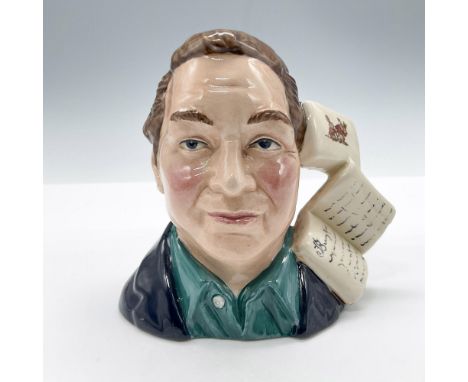 Small character jug of Terry Matthews with light brown hair, navy-blue coat with a dark-turquoise shirt. Books of Bunnykins f