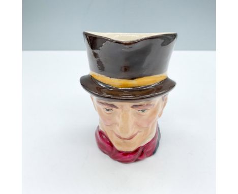 Figural jug with a gray jacket, red scarf, and a brown hat with a yellow band. A riding crop and a hunting horn formed the ha