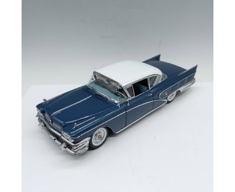 Yale blue 1:18 scale model car from the Platinum Collection with teal interiors and chrome accents. Moveable parts include ho
