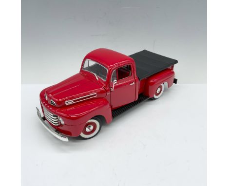 Candy red 1:18 scale truck model with a wide body and truck bed. Moveable parts include hood, doors and truck bed closure. Ro