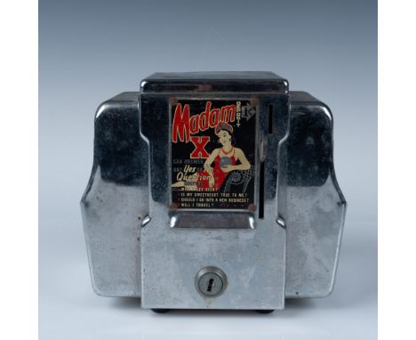 A rare and charming vintage "Madam X" fortune teller napkin holder, crafted as a coin-operated novelty device from the mid-20