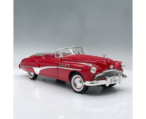 Red open convertible model car designed at a one eighteenth scale ratio. It features two doors, a trunk and hood that opens w