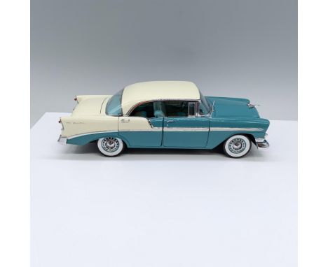 Limited edition sticker in trunk, Painted aqua and beige, hood, trunk and 4 doors open, front wheels turn. Marked Precision M