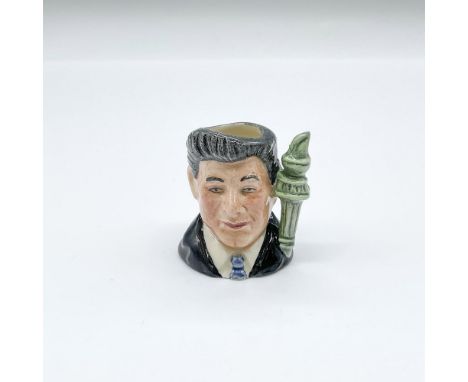 20th century icon. Hand painted prototype colorway tiny figural jug of the 40th U.S. President. Black suit, blue tie, and gra