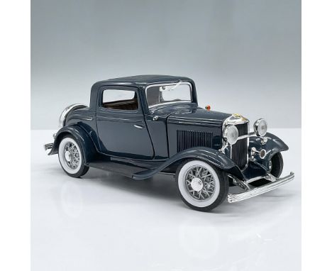 Dark Blue model car featuring a brown interior and movable parts including the two doors, the hood, the front seats, trunk an