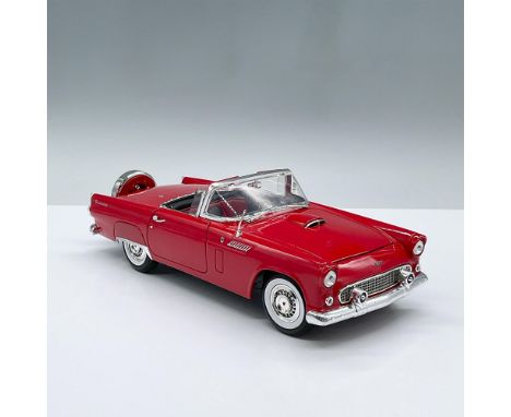 Red model car designed at a one eighteenth scale ratio. It features two doors and a trunk that opens. Marked Motormax. No.731