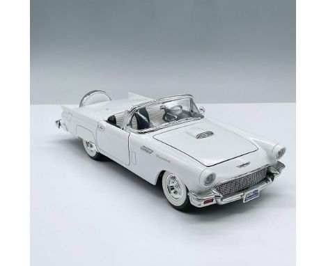 White model car designed at a one eighteenth scale ratio. It features two doors, a trunk and hood that opens. Marked Road Sig