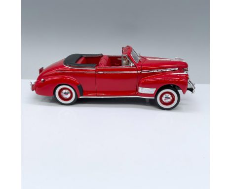 Painted red with red interior, hood, trunk and doors open, front wheels turn. Marked Welly. Issued: 20th centuryDimensions: 1