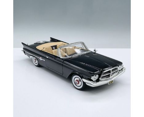 This classic black open convertible model car features a tan interior and movable parts including the two doors, the hood and