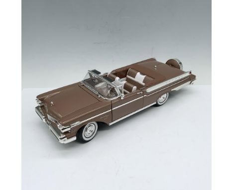 Fabulous depiction of a unique pale brown convertible with matching interiors and whitewall tires. Driver and passenger doors