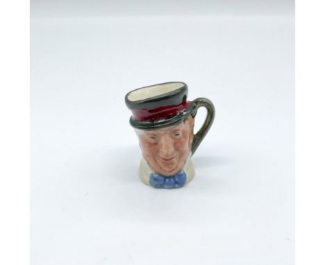 Rare hand painted tiny figural jug of a Charles Dickens characters from the classic, David Copperfield. White coat, blue bow 