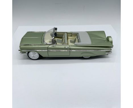 Convertible in light green with beige interior, doors and hood open. Marked Road SignatureIssued: 21st centuryDimensions: 12.