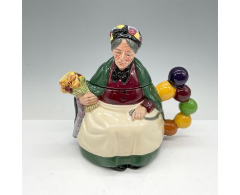 Part of the Teapot series this porcelain beloved character is designed and colored in green, yellow, burgundy and brown. Roya
