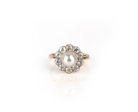 A natural pearl and diamond ring, early 20th century, set with a natural pearl measuring 7.9mm, within a border of circular-c